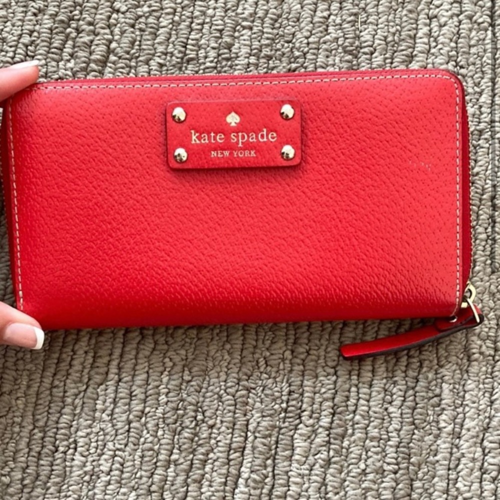 Red Kate spade wallet lightly used- matching day planner available too